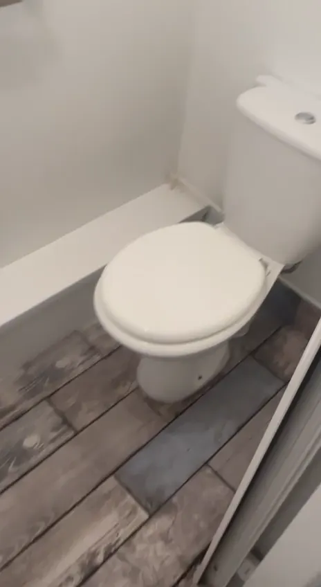 New toilet, basin and bath in a refitted bathroom