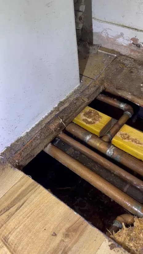Copper pipework reached by lifting the floorboards