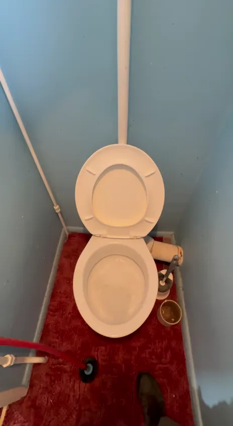 A high-level cistern toilet flush tested after repair